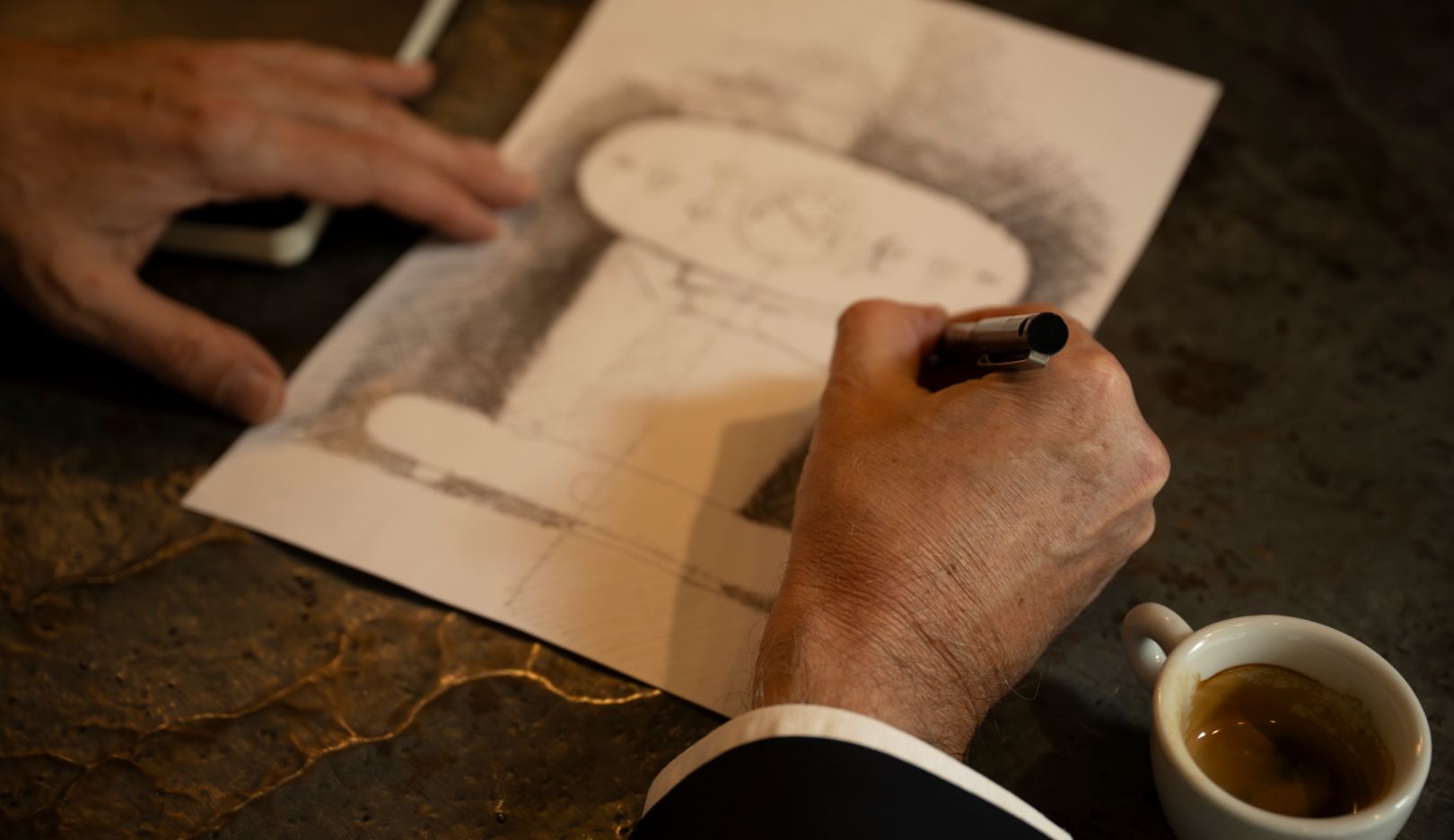 Off the cuff: Trazzi sketches the Illy X1 espresso machine he designed, which today is a design classic.